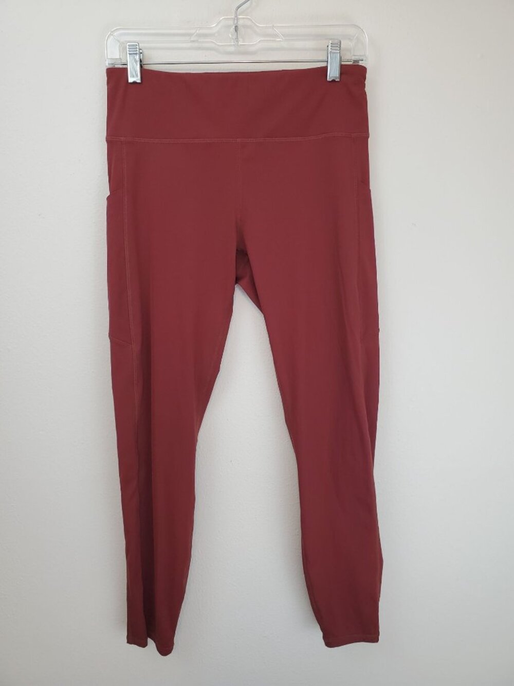 Vuori Stride leggings, drop-in pockets, brick red
